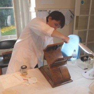 Amanda, one of the VSA team, cleaning a stereoscope